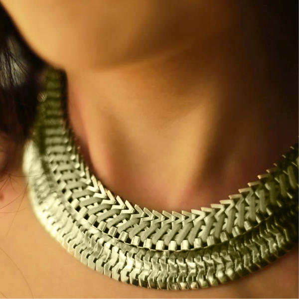 Woman wearing an elegant gold necklace