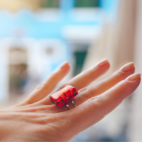 Woman wearing a large ruby red ring